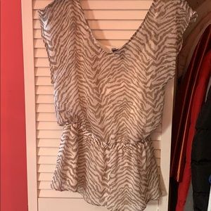 Sheer blouse with tank top.